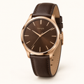 bengik Copperline watch: round rose-gold-tone case, walnut-brown dial, slim baton markers and dark brown leather-look strap, main three-quarter view.