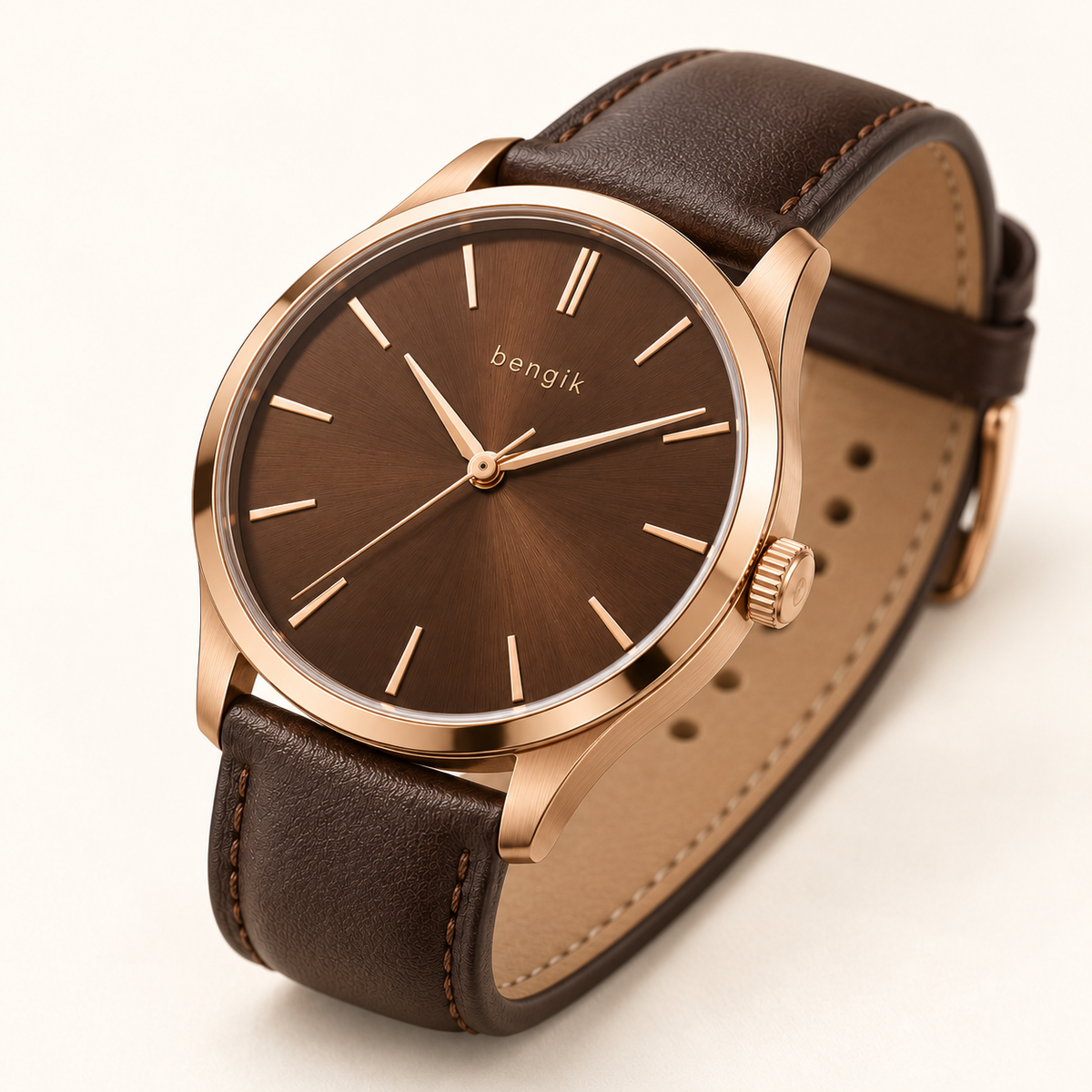 bengik Copperline watch: round rose-gold-tone case, walnut-brown dial, slim baton markers and dark brown leather-look strap, diagonal detail view.