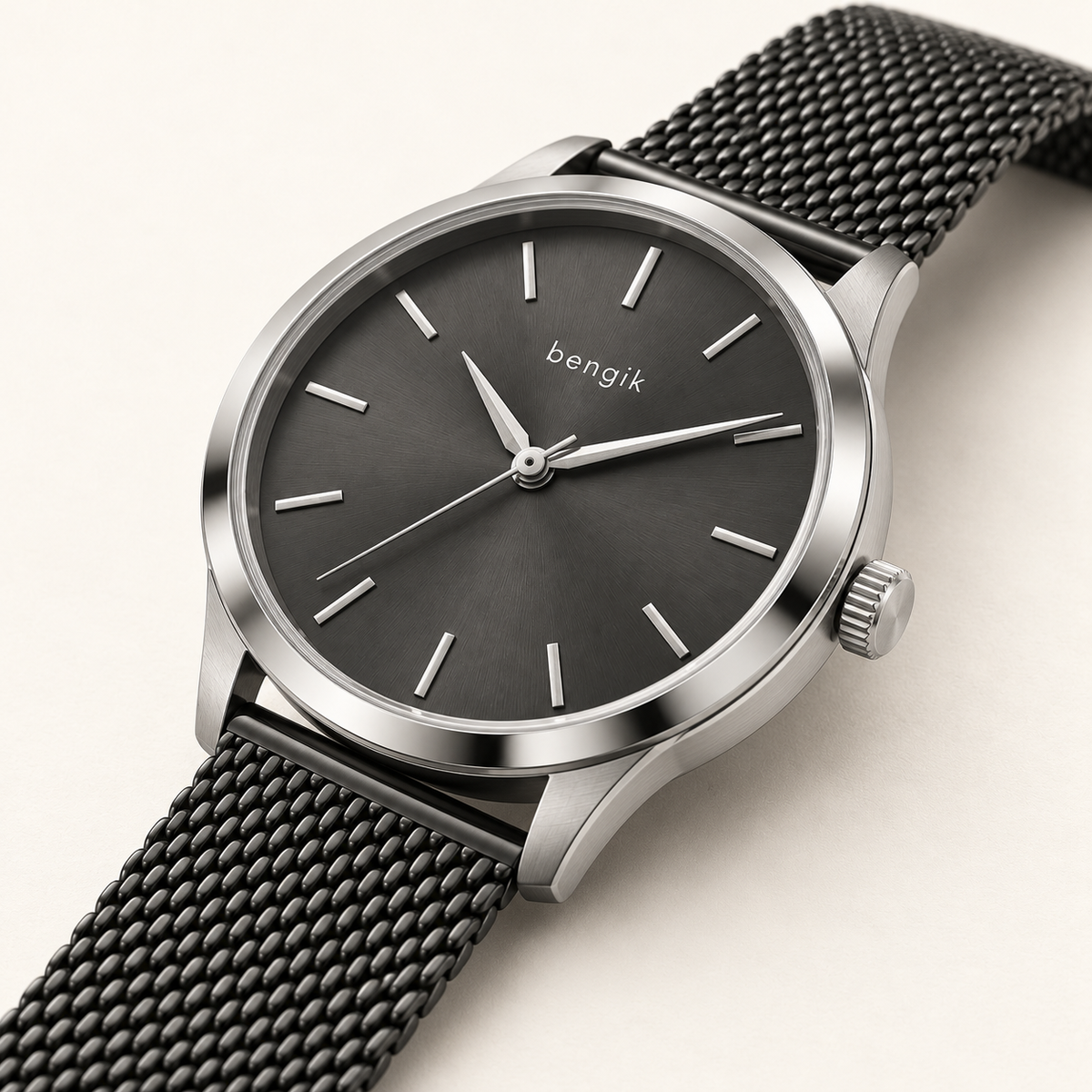 bengik Eclipse watch: round silver-tone case, charcoal dial, minimalist baton markers and black mesh bracelet, diagonal detail view.
