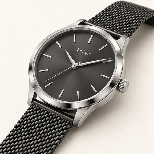 bengik Eclipse watch: round silver-tone case, charcoal dial, minimalist baton markers and black mesh bracelet, diagonal detail view.